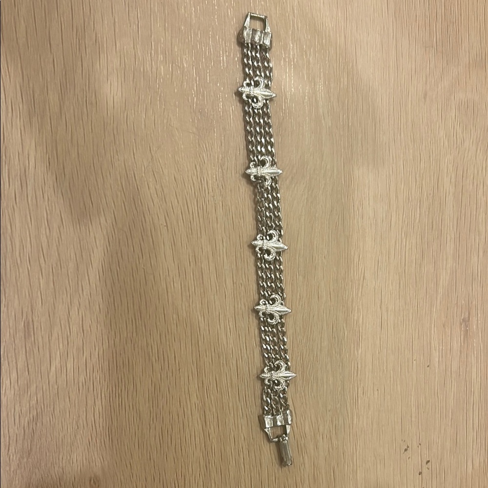 Silver toned fleur de Lis multi chain bracelet